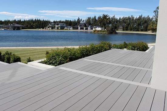 WPC decking overlooking a serene lake with scenic surroundings