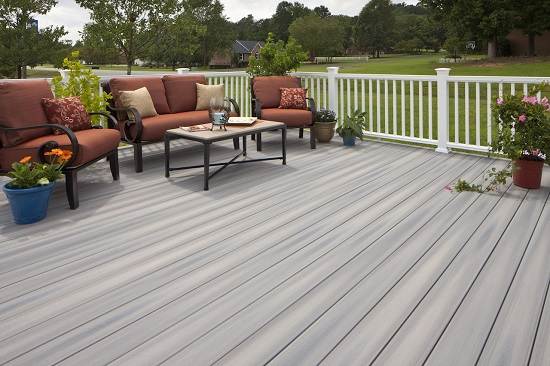 WPC decking with outdoor seating and plants in a scenic setting