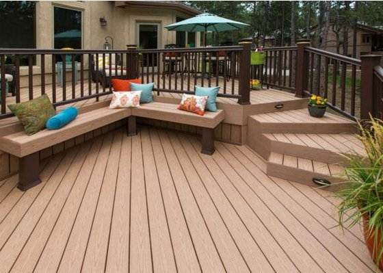 "WPC decking with corner seating, steps, and vibrant cushions