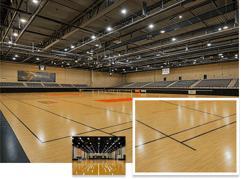 Large indoor sports arena with Sports flooring and markings for multiple sports.
