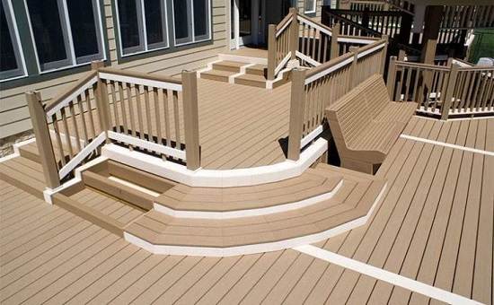 WPC decking with stairs, seating, and railing in a spacious design