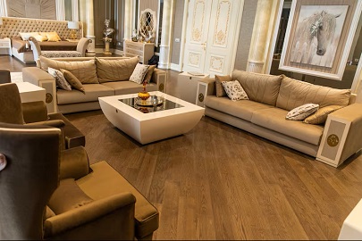 Dark engineered wood flooring in a luxury living room setting