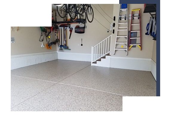 Garage with speckled epoxy flooring and wall-mounted storage