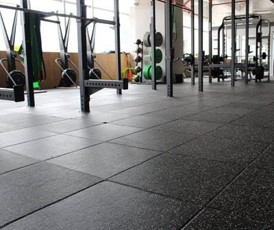 Gym with heavy-duty black rubber tile flooring