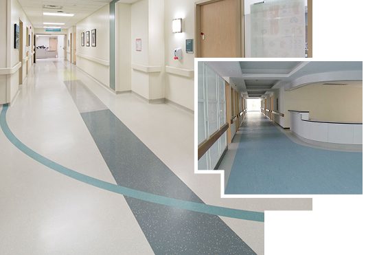 Hospital corridor with patterned vinyl flooring and clean light-tone walls
