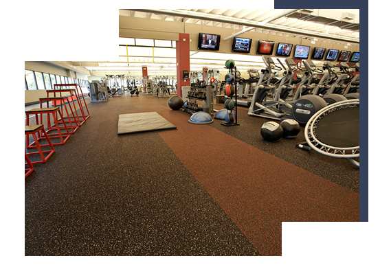 Spacious gym with rubber flooring and workout equipment