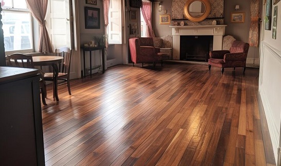 Warm-toned engineered wood flooring in a classic living room with vintage decor