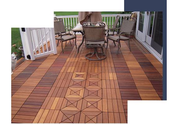 Wooden deck with patterned interlocking tiles and patio furniture