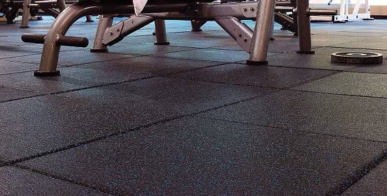 Heavy gym equipment placed on thick interlocking EPDM rubber tiles