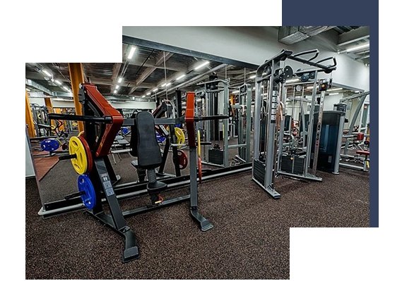 Strength training machines placed on brown EPDM rubber gym flooring